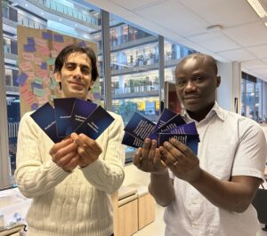 Amir (left) and OB (right) holding our card sorting cards.